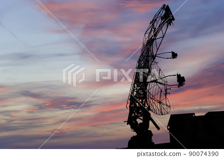 Air defense radars of military mobile anti aircraft systems, modern army industry on the background of the sunset orange sky, Russia Air defense radars of military mobile anti aircraft systems, modern army industry on the background of the sunset orange sky, Russia 90074390