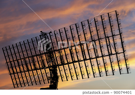 Air defense radars of military mobile anti aircraft systems, modern army industry on the background of the sunset orange sky, Russia 90074401