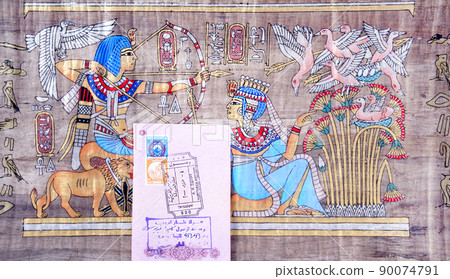Page of the passport with the visa Egypt Hurghada International Airport on the background of the papyrus 90074791