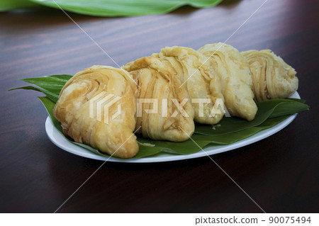 Malaysia popular and traditional snack Karipap filled with potato fillings. 90075494