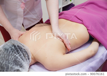 Massage on problem areas for slimming and body shaping. 90076161