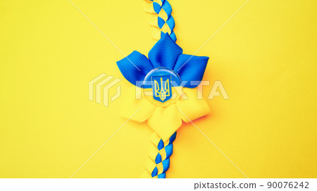 Ukrainian flower trident symbol isolated on yellow. Yellow blue banner background, flat lay, copy space. Ukrainian flower trident symbol isolated on yellow. Yellow blue banner background, flat lay, copy space. 90076242