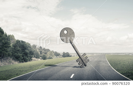 Conceptual background image of concrete key sign on asphalt road Conceptual background image of concrete key sign on asphalt road 90076320