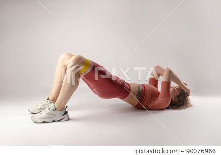 athletic girl posing in the Studio on a white background athletic girl posing in the Studio on a white background 90076966