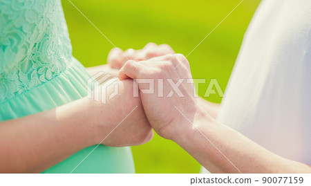 Couple in love holding hands. 90077159