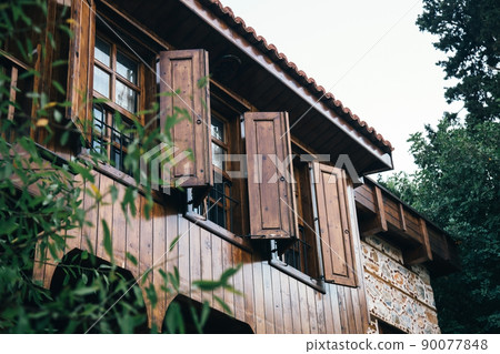 open wooden shutters on wooden windows in a Turkish house. 90077848