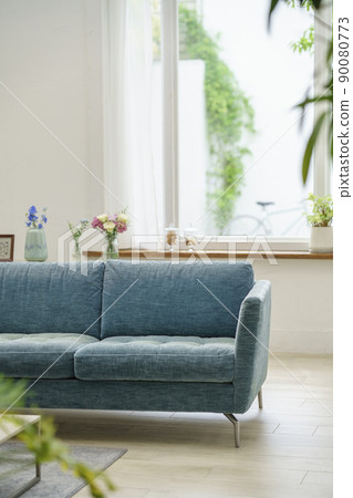 Living room with blue sofa Living room with blue sofa 90080773