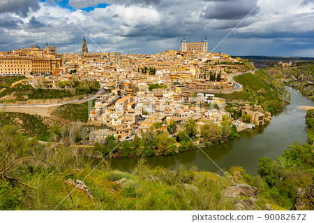 Toledo cityscape on Tagus river with ancient Cathedral and Alcazar castle Toledo cityscape on Tagus river with ancient Cathedral and Alcazar castle 90082672