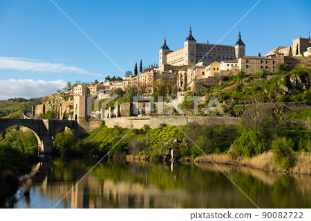 Landscape with a view of the Alcantara Bridge and the Alcazar de Toledo Castle 90082722