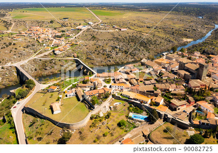 Drone view of Ledesma townscape on banks of Tormes river, Spain 90082725