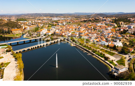 Aerial view of Mirandela with fountain and bridges crossing Tua river, Portugal 90082939