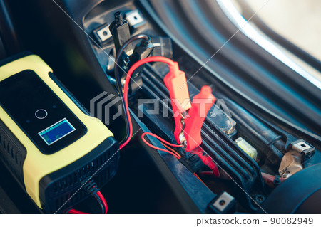 Charging battery and repair in motorcycle for start by portable trickle charger and clamp. 90082949