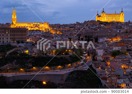 Toledo cityscape with lighted Cathedral and Alcazar in spring twilight Toledo cityscape with lighted Cathedral and Alcazar in spring twilight 90083014