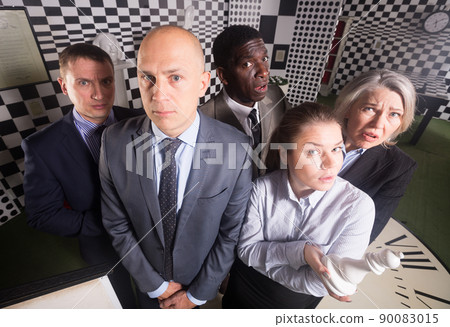 Thoughtful people at escape room Thoughtful people at escape room 90083015