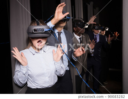 Excited girl in virtual reality room Excited girl in virtual reality room 90083282