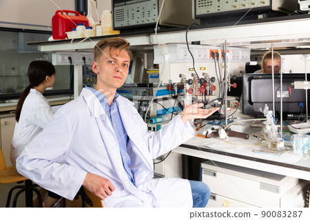 Adult male scientist sitting at biochemical lab Adult male scientist sitting at biochemical lab 90083287