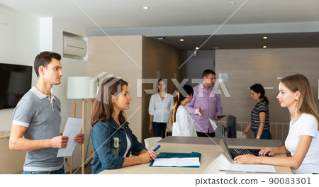 female lawyer sitting with laptop and consulting her clients female lawyer sitting with laptop and consulting her clients 90083301