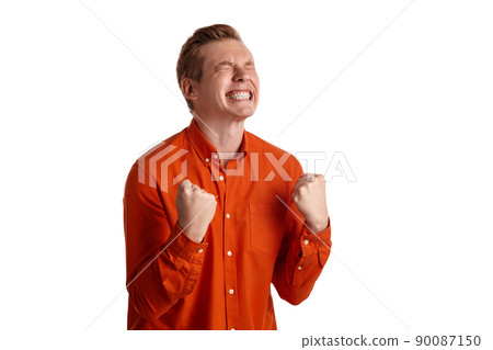 Close-up portrait of a ginger guy in orange shirt posing isolated on white background. Sincere emotions. Close-up portrait of a ginger guy in orange shirt posing isolated on white background. Sincere emotions. 90087150