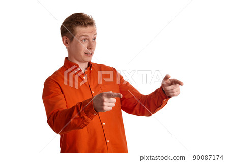 Close-up portrait of a ginger guy in orange shirt posing isolated on white background. Sincere emotions. Close-up portrait of a ginger guy in orange shirt posing isolated on white background. Sincere emotions. 90087174