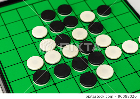 Othello board and black and white stones Othello board and black and white stones 90088020