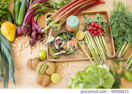 Table full of fresh food ingredients Table full of fresh food ingredients 90088615