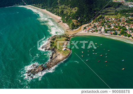 Coastline with rocky island, beach and ocean with waves and boats. Aerial view. Matadeiro Beach and Ponta das Campanhas Coastline with rocky island, beach and ocean with waves and boats. Aerial view. Matadeiro Beach and Ponta das Campanhas 90088878