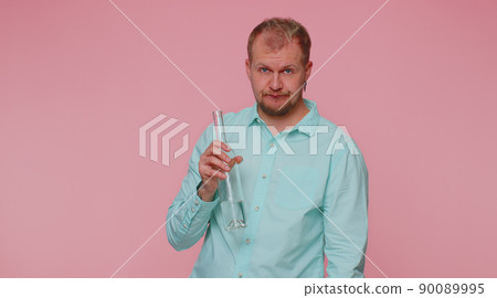 Drunk man after party drinks vodka from bottle, celebrating victory win, alcohol addiction problem Drunk man after party drinks vodka from bottle, celebrating victory win, alcohol addiction problem 90089995