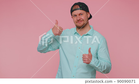 Bearded man raises thumbs up agrees or gives positive reply recommends advertisement likes good Bearded man raises thumbs up agrees or gives positive reply recommends advertisement likes good 90090071