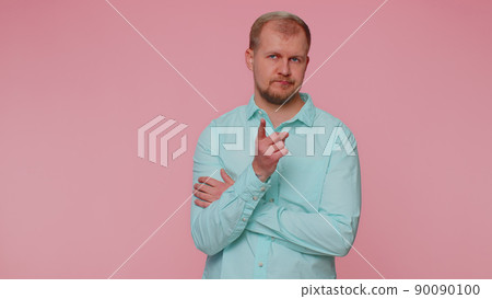 Displeased man shakes finger, saying no, be careful, scolding, giving advice to avoid danger mistake 90090100