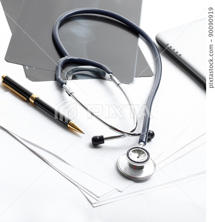 stethoscope,x-ray and pen on the table. photo with copy space 90090919