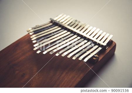 Traditional wooden kalimba isolated on white Traditional wooden kalimba isolated on white 90091536