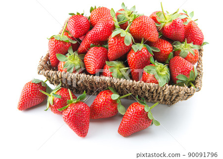 Fresh strawberries on table with basket 90091796