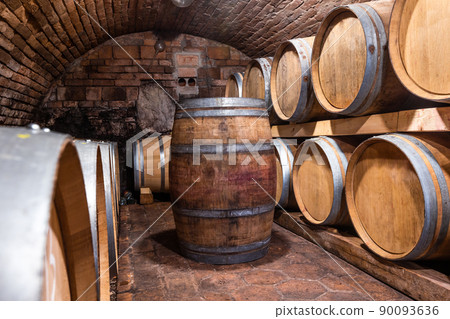 A wine cellar full of barrels of wine, alcohol concept 90093636