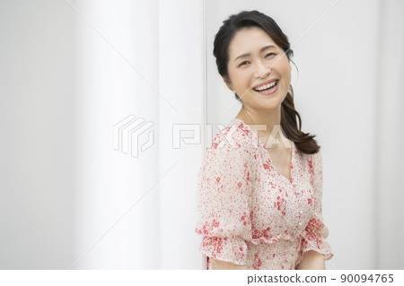 A smiling woman in her 50s, a beauty image portrait A smiling woman in her 50s, a beauty image portrait 90094765