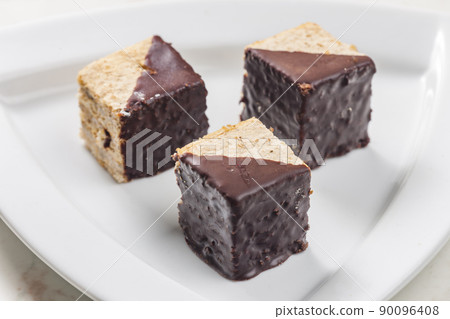 nutty sponge cakes with chocolate coating nutty sponge cakes with chocolate coating 90096408