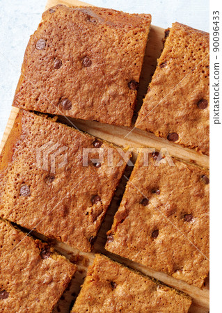 Blondie brownie dessert bars with chocolate chips, shot from above Blondie brownie dessert bars with chocolate chips, shot from above 90096433
