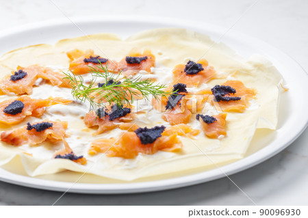 pancake with smoked salmon, black caviar and sour cream pancake with smoked salmon, black caviar and sour cream 90096930