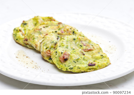 still life of zucchini cakes with bacon 90097234