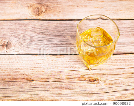 glass for liquor Translucent elements made of glass are placed on a wooden table. empty objects isolated on white background glass for liquor Translucent elements made of glass are placed on a wooden table. empty objects isolated on white background 90098922
