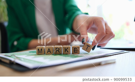 Text market on cubes and businesswoman at workplace 90099533