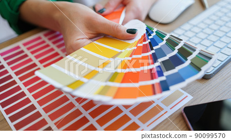 Graphic designer is working on choosing palette colors for creative business 90099570