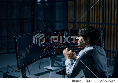 happy businessman looking at the computer screen. happy businessman looking at the computer screen. 90099987