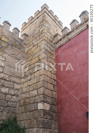 Royal Alcazar of Seville, a walled palatial complex built in different historical stages. Royal Alcazar of Seville, a walled palatial complex built in different historical stages. 90100275