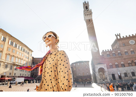Woman on the main square of Siena town in Italy Woman on the main square of Siena town in Italy 90100760