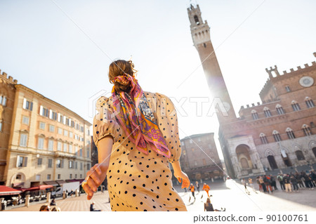 Woman on the main square of Siena town in Italy Woman on the main square of Siena town in Italy 90100761