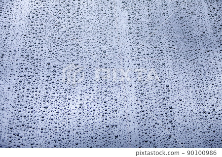 Raindrops running down the glass Raindrops running down the glass 90100986