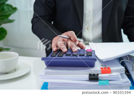 Businessman working and prepare paperwork report data to analysis information in file binder at office. 90101394