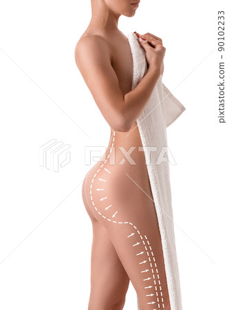 Female body with the drawing arrows on it isolated on white. Fat lose, liposuction and cellulite removal concept. 90102233