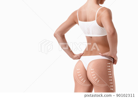 Female body with the drawing arrows on it isolated on white. Fat lose, liposuction and cellulite removal concept. Female body with the drawing arrows on it isolated on white. Fat lose, liposuction and cellulite removal concept. 90102311
