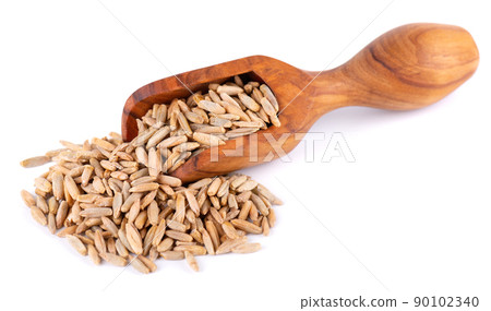 Rye grains isolated on white background. Pile of rye malt seeds in olive scoop. Dry grains of winter rye. 90102340